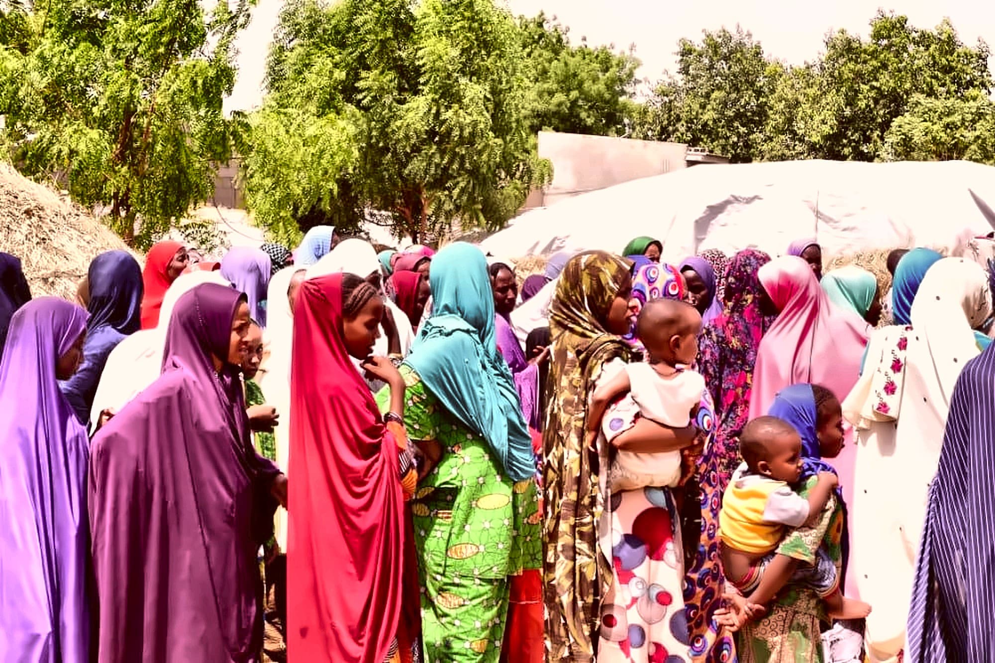Mothers and children gathered at a Dar Al Ayetam community event in Nigeria